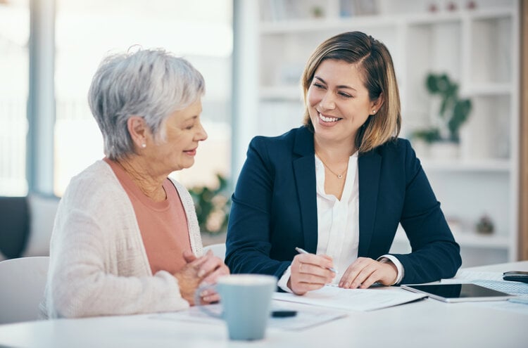 businesswoman planning contracts with a client